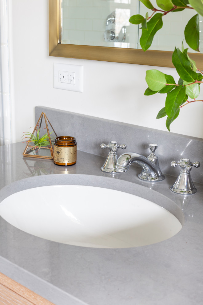 Example of a mid-sized transitional master white tile ceramic tile, white floor and double-sink alcove shower design in Chicago with shaker cabinets, light wood cabinets, a two-piece toilet, gray walls, a drop-in sink, quartz countertops, a hinged shower door, gray countertops and a freestanding vanity