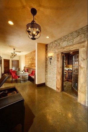 Example of a mid-sized mountain style concrete floor wine cellar design
