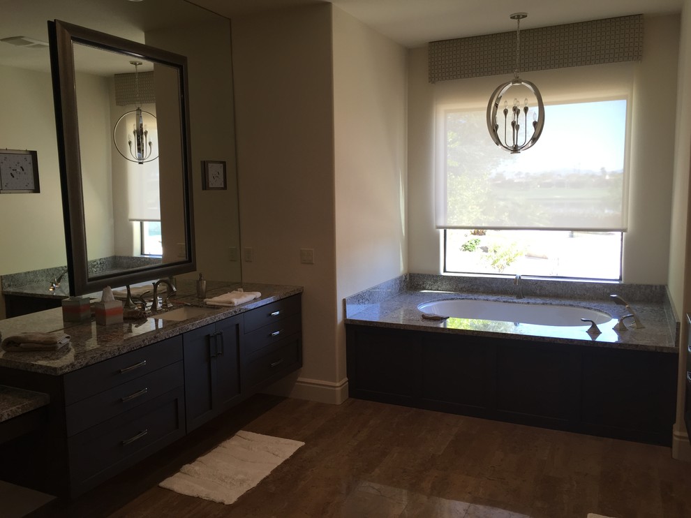 Alcove bathtub - mid-sized transitional alcove bathtub idea with shaker cabinets, black cabinets, a two-piece toilet, beige walls and an undermount sink