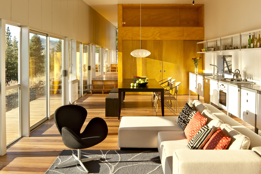 Photo of a contemporary open concept living room in Seattle with beige walls.