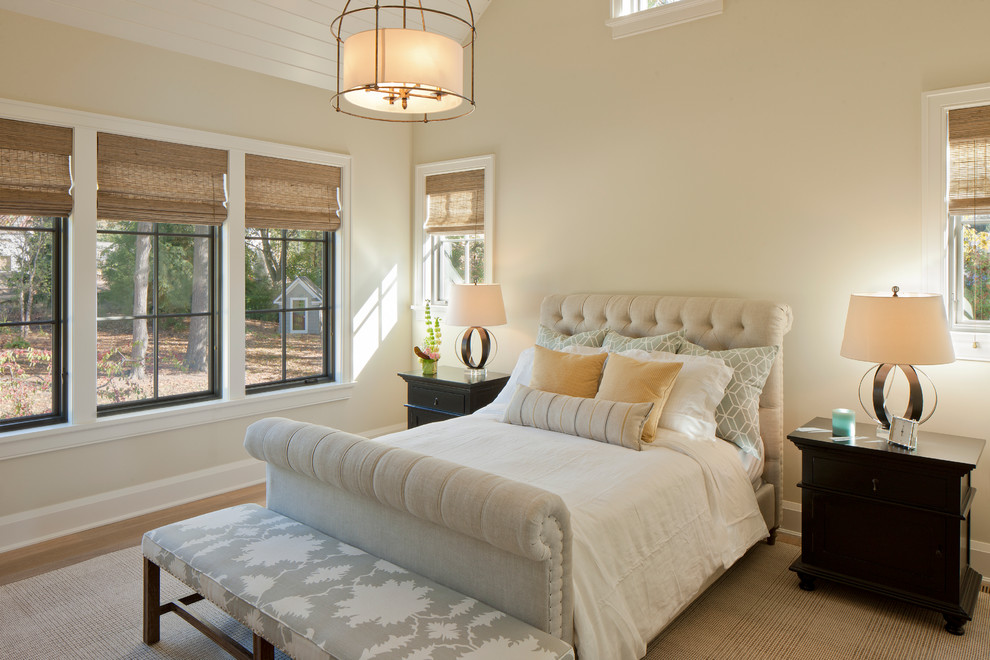 Photo of a transitional bedroom in Grand Rapids with beige walls.