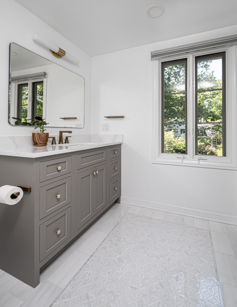 Shower bench - mid-sized traditional marble floor, white floor and single-sink shower bench idea in New York with shaker cabinets, gray cabinets, a one-piece toilet, white walls, an undermount sink, quartz countertops, a hinged shower door, white countertops and a built-in vanity