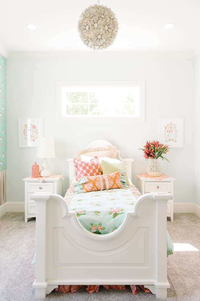 This is an example of a transitional kids' bedroom for girls in Salt Lake City with white walls and carpet.