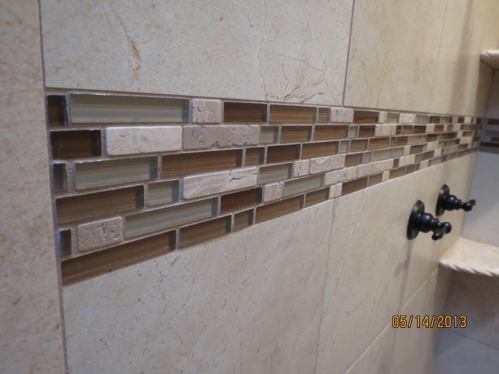 Inspiration for a mid-sized transitional master beige tile and porcelain tile dark wood floor bathroom remodel with shaker cabinets, dark wood cabinets, beige walls, granite countertops and an undermount sink