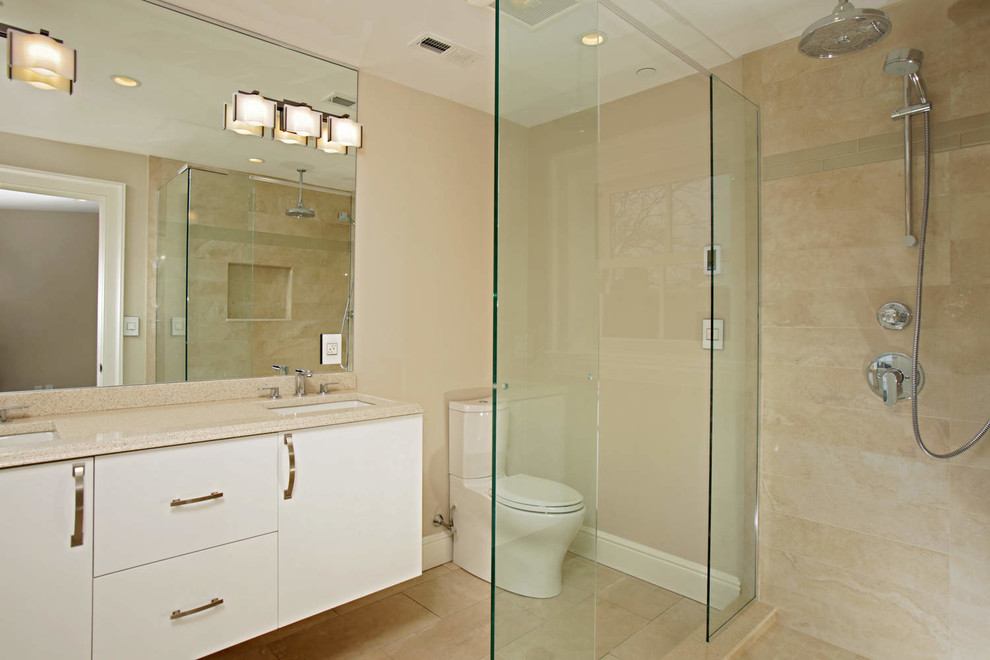 Inspiration for a mid-sized transitional master bathroom remodel in Boston with an undermount sink, shaker cabinets, white cabinets, quartz countertops and a one-piece toilet