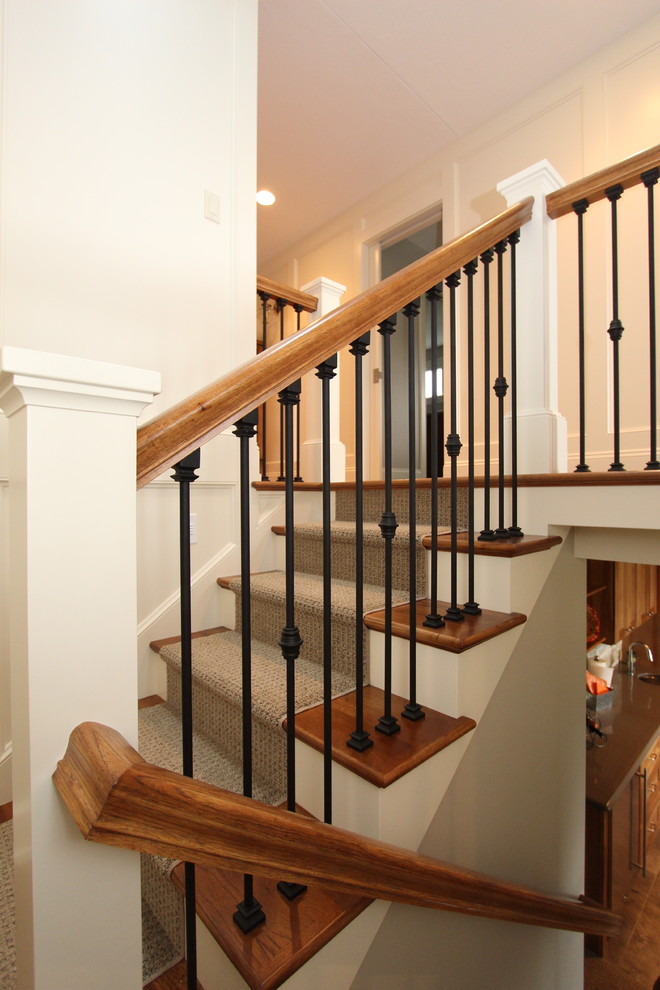 This is an example of a mid-sized transitional staircase in Grand Rapids.