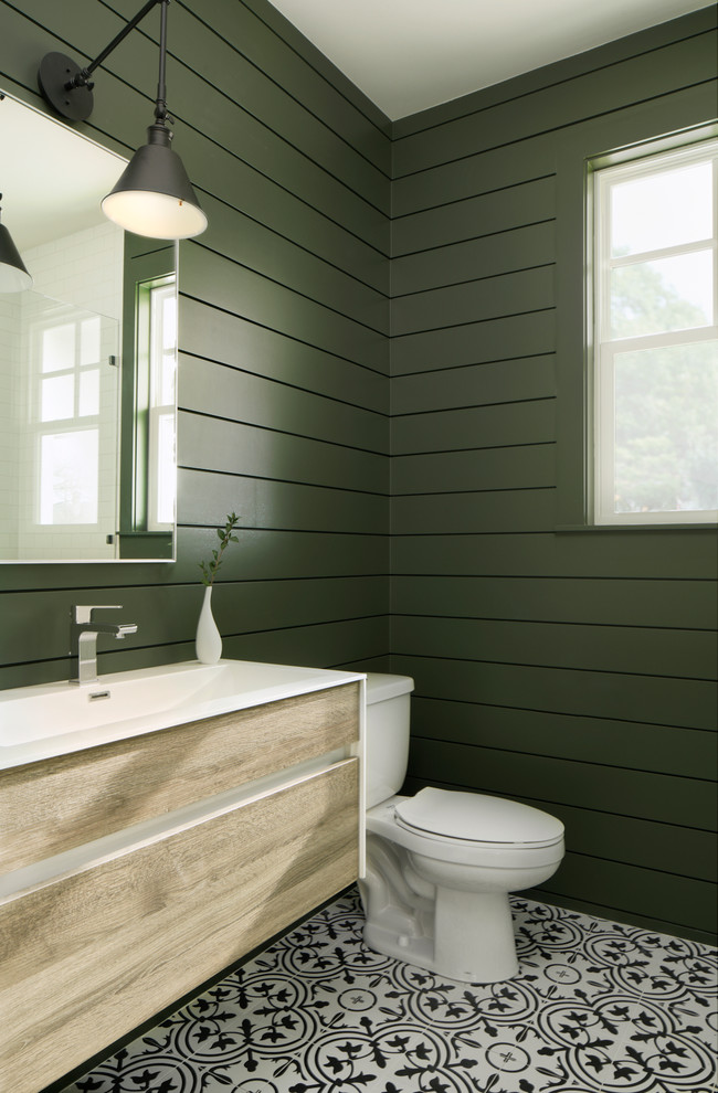 Design ideas for a large country bathroom in Austin with flat-panel cabinets, medium wood cabinets, green tile, green walls, a console sink, multi-coloured floor and white benchtops.