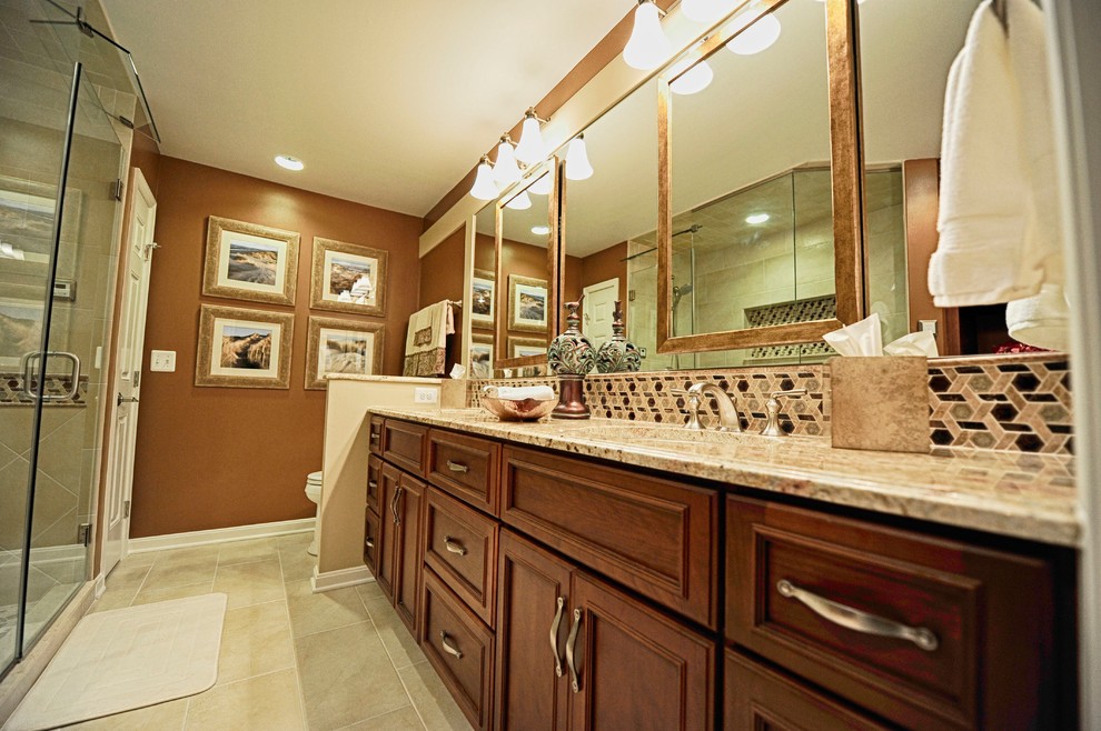 This is an example of a mid-sized transitional bathroom in Baltimore with an undermount sink, recessed-panel cabinets, medium wood cabinets, granite benchtops, beige tile, porcelain tile, brown walls, porcelain floors and with a sauna.