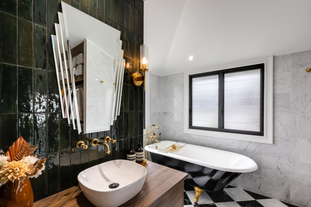 Photo of a midcentury ensuite bathroom in Brisbane with shaker cabinets, dark wood cabinets, a claw-foot bath, a walk-in shower, a two-piece toilet, green tiles, metro tiles, marble flooring, a vessel sink, wooden worktops, multi-coloured floors, an open shower, a wall niche, a single sink and a floating vanity unit.