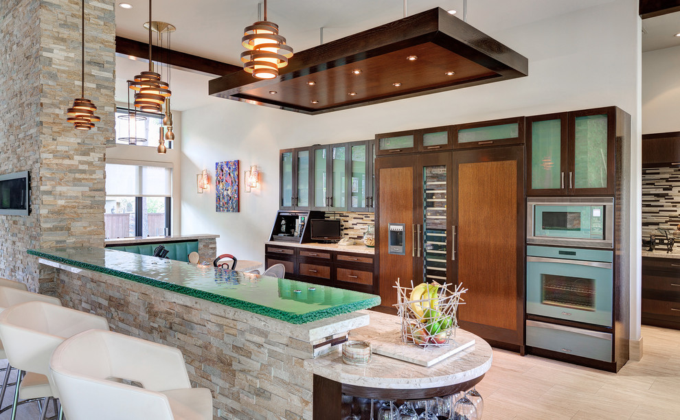Photo of a contemporary kitchen in Houston with glass-front cabinets, dark wood cabinets, glass benchtops, multi-coloured splashback, matchstick tile splashback, panelled appliances and green benchtop.
