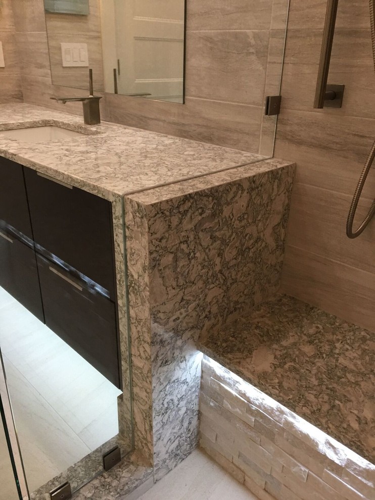 Inspiration for a large contemporary master bathroom in Orlando with flat-panel cabinets, dark wood cabinets, a drop-in tub, a double shower, white tile, porcelain tile, porcelain floors, an undermount sink and engineered quartz benchtops.