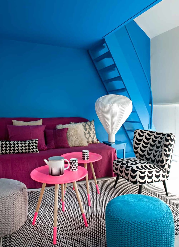 Photo of a mid-sized contemporary open concept family room in Paris with no tv and multi-coloured walls.