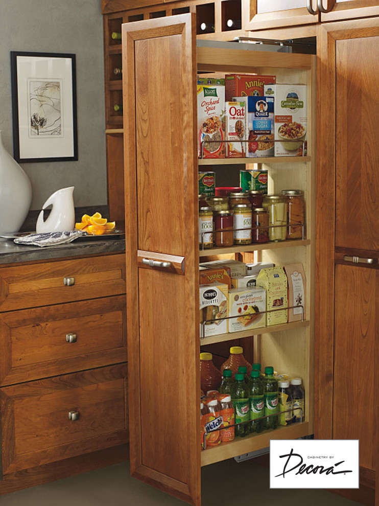 Small l-shaped eat-in kitchen photo with medium tone wood cabinets, stainless steel appliances, a peninsula and gray countertops