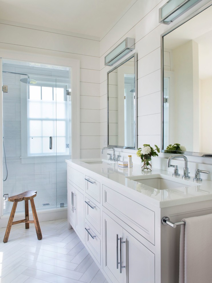 Inspiration for a large contemporary master bathroom in Providence with a one-piece toilet, white walls, marble floors, recessed-panel cabinets, white cabinets, an alcove shower, a wall-mount sink and engineered quartz benchtops.
