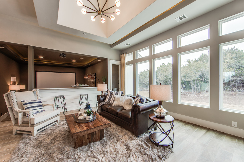 Design ideas for a large country open concept living room in Dallas with grey walls, porcelain floors and beige floor.