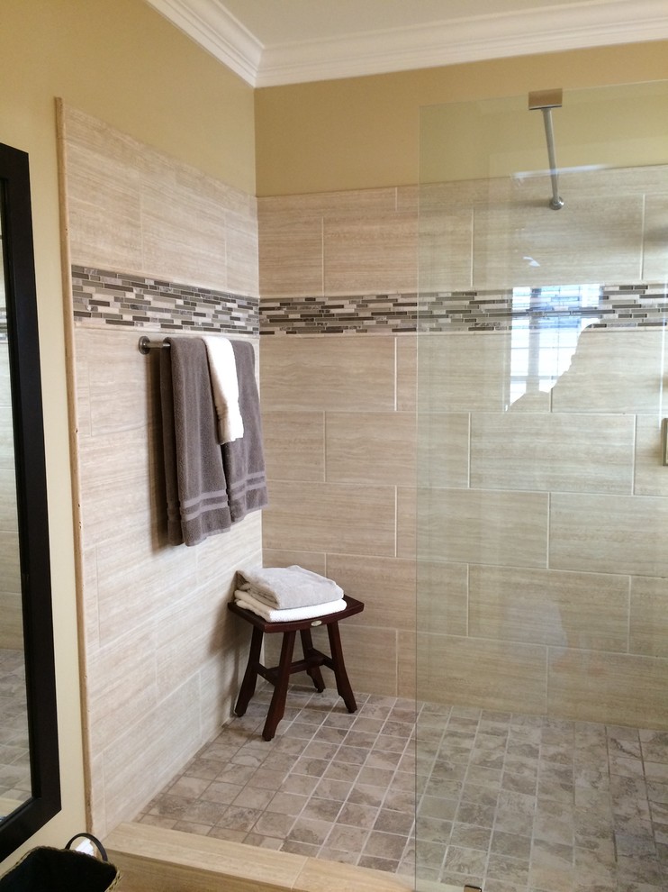 Photo of a mid-sized transitional 3/4 bathroom in Raleigh with a corner shower, beige tile, porcelain tile, beige walls, porcelain floors, beige floor and an open shower.