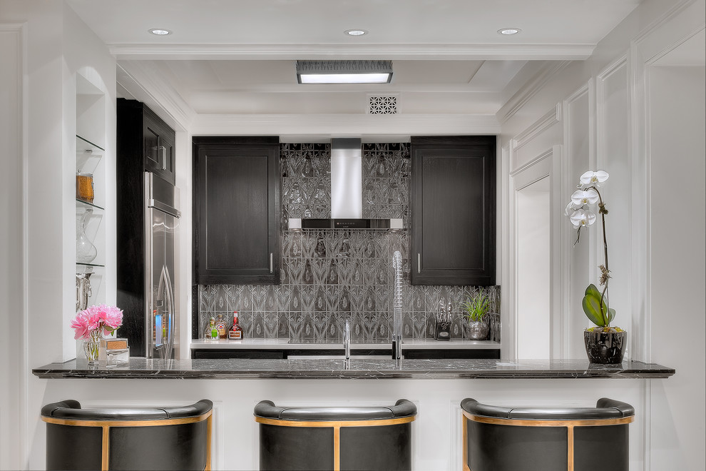 Contemporary separate kitchen in Houston with recessed-panel cabinets, black cabinets, metallic splashback and stainless steel appliances.