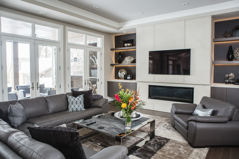 Photo of a large contemporary enclosed living room in Toronto with white walls, a ribbon fireplace and a wall-mounted tv.