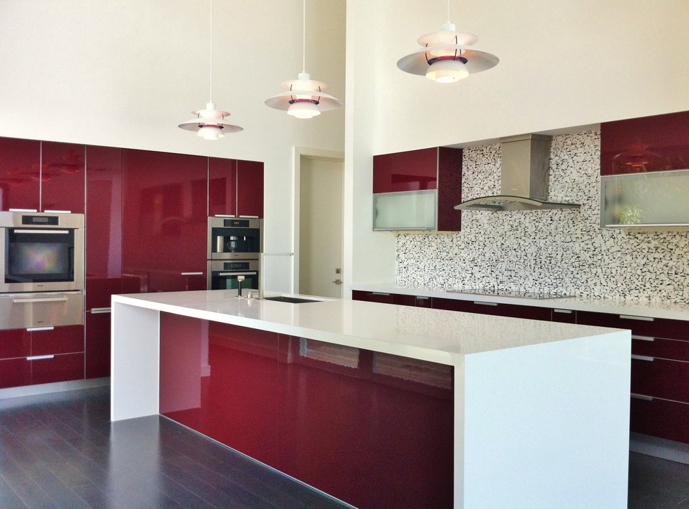 Inspiration for a contemporary kitchen in Miami with mosaic tile splashback, multi-coloured splashback, flat-panel cabinets, red cabinets and an undermount sink.