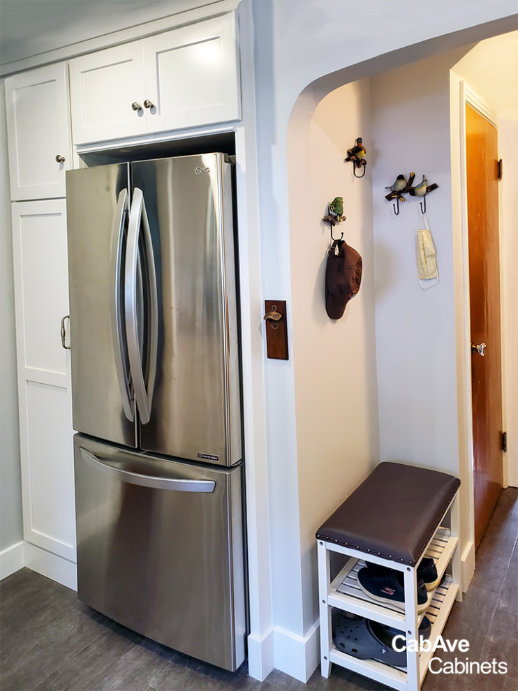 Eat-in kitchen - small transitional u-shaped dark wood floor and gray floor eat-in kitchen idea in New York with shaker cabinets, white cabinets, granite countertops, multicolored backsplash, porcelain backsplash, no island, black countertops, an undermount sink and stainless steel appliances
