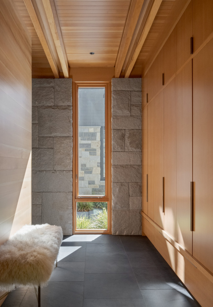 Inspiration for a mid-sized modern two-story mixed siding and clapboard blue entryway remodel in Boston