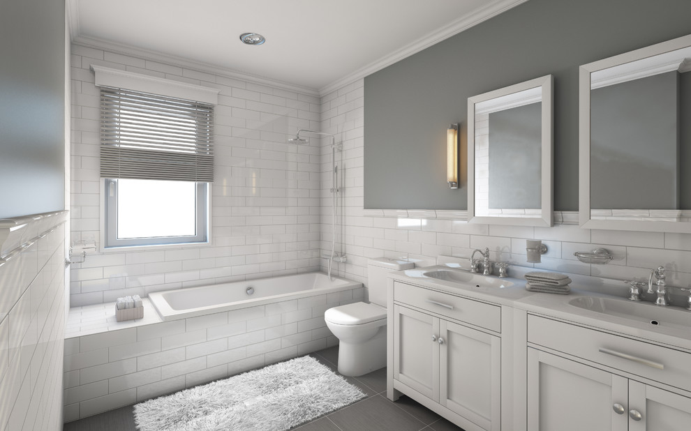 Inspiration for a large traditional master bathroom in Chicago with shaker cabinets, white cabinets, a drop-in tub, a shower/bathtub combo, a two-piece toilet, white tile, subway tile, white walls, porcelain floors, an integrated sink, solid surface benchtops, grey floor and an open shower.