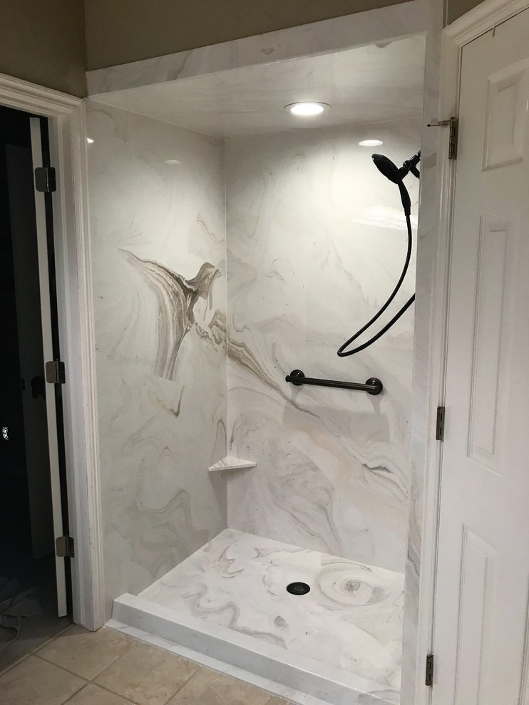 Inspiration for a mid-sized traditional bathroom in Oklahoma City with an alcove shower, gray tile, stone slab, beige walls, ceramic floors and beige floor.