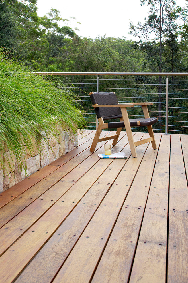 Design ideas for a large contemporary backyard deck in Sydney.