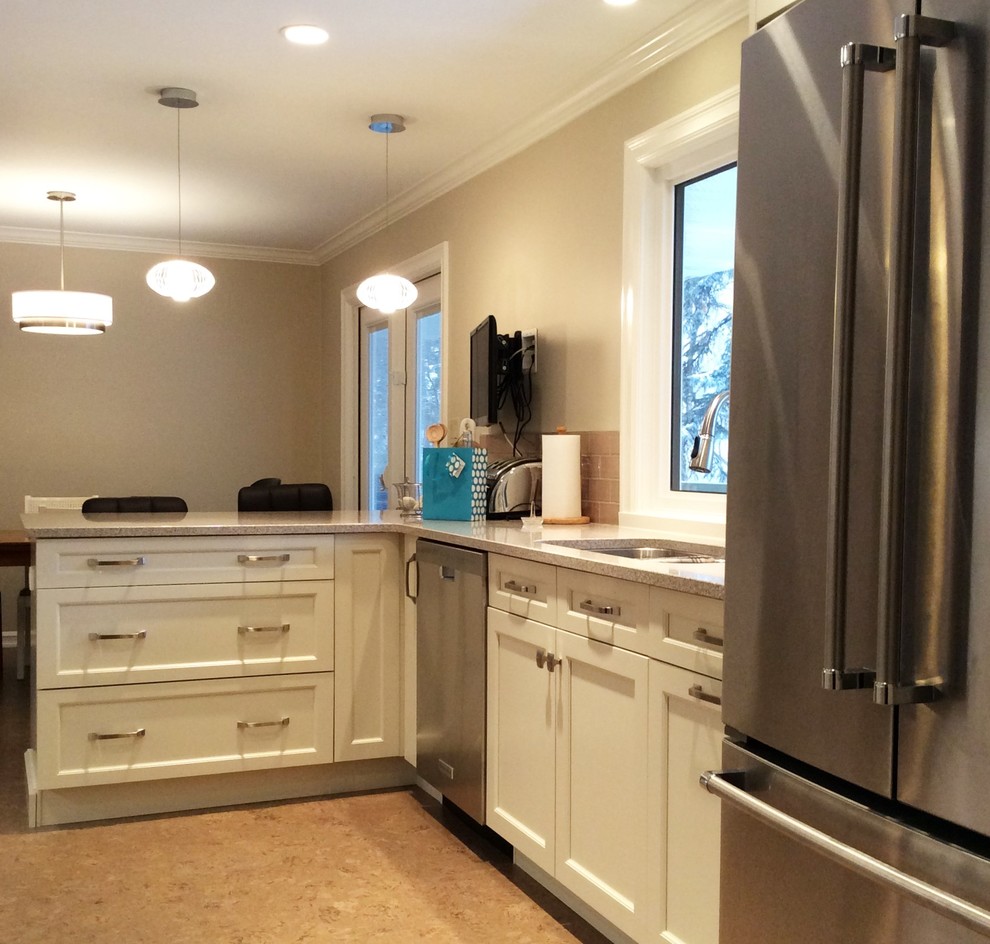 Example of a transitional cork floor kitchen design in Edmonton with white cabinets, quartzite countertops, gray backsplash, ceramic backsplash and stainless steel appliances