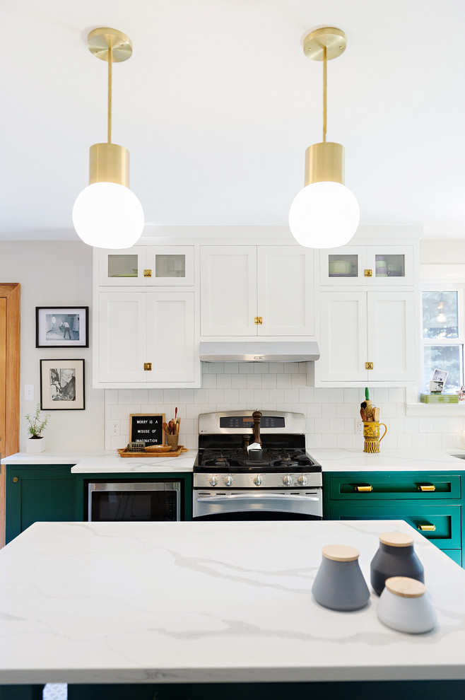 Inspiration for a large transitional porcelain tile and multicolored floor enclosed kitchen remodel with a drop-in sink, shaker cabinets, white cabinets, marble countertops, white backsplash, ceramic backsplash, stainless steel appliances and an island