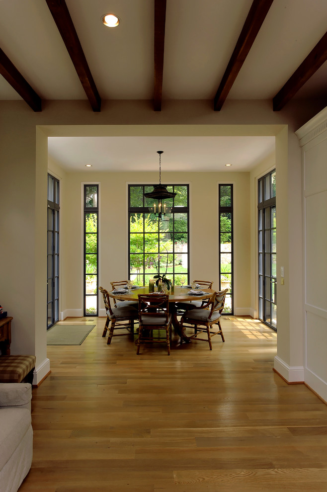 This is an example of a mediterranean separate dining room in DC Metro with medium hardwood floors.