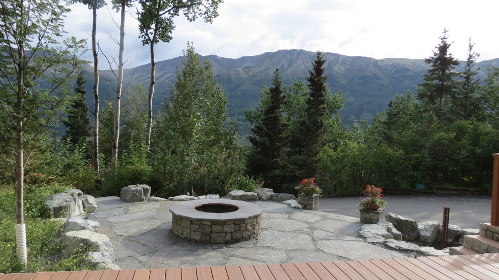 Design ideas for a large rustic full sun side yard stone landscaping.