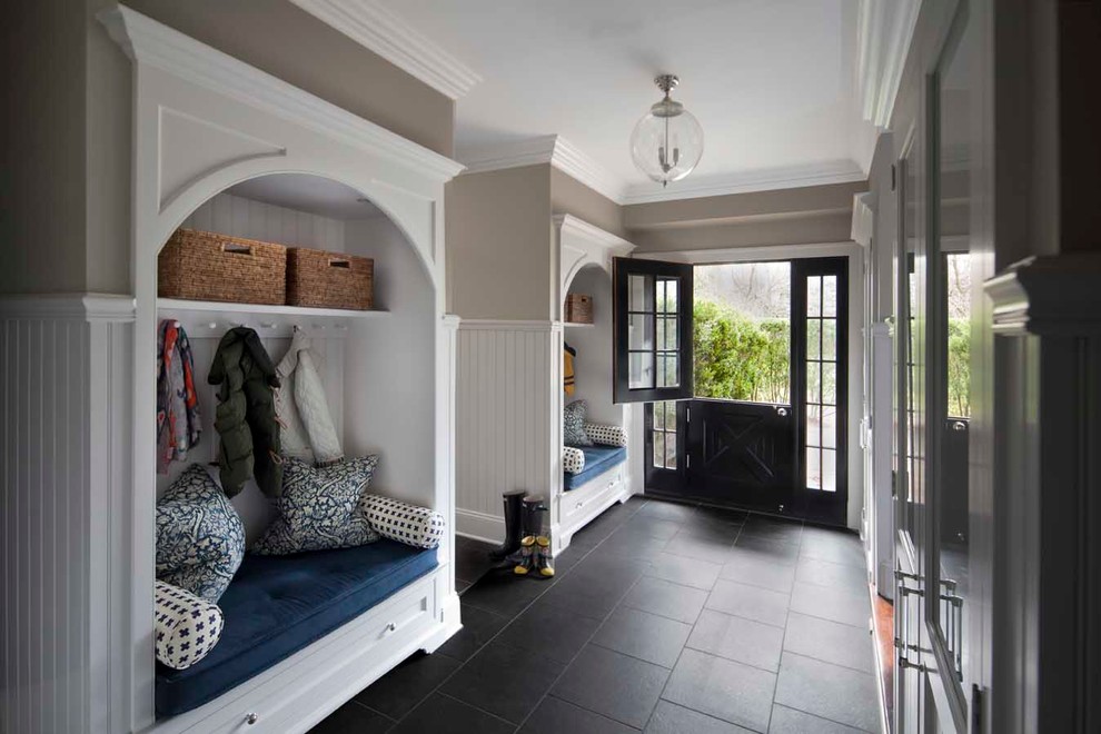 Traditional mudroom in New York with grey walls, a dutch front door, a black front door, slate floors and black floor.