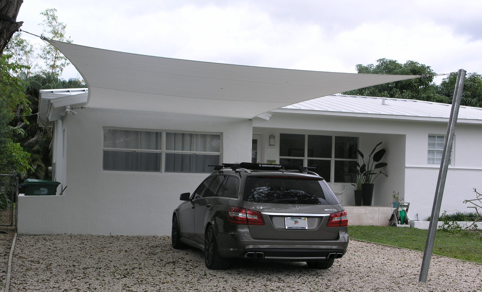 This is an example of a mid-sized contemporary garage in Miami.