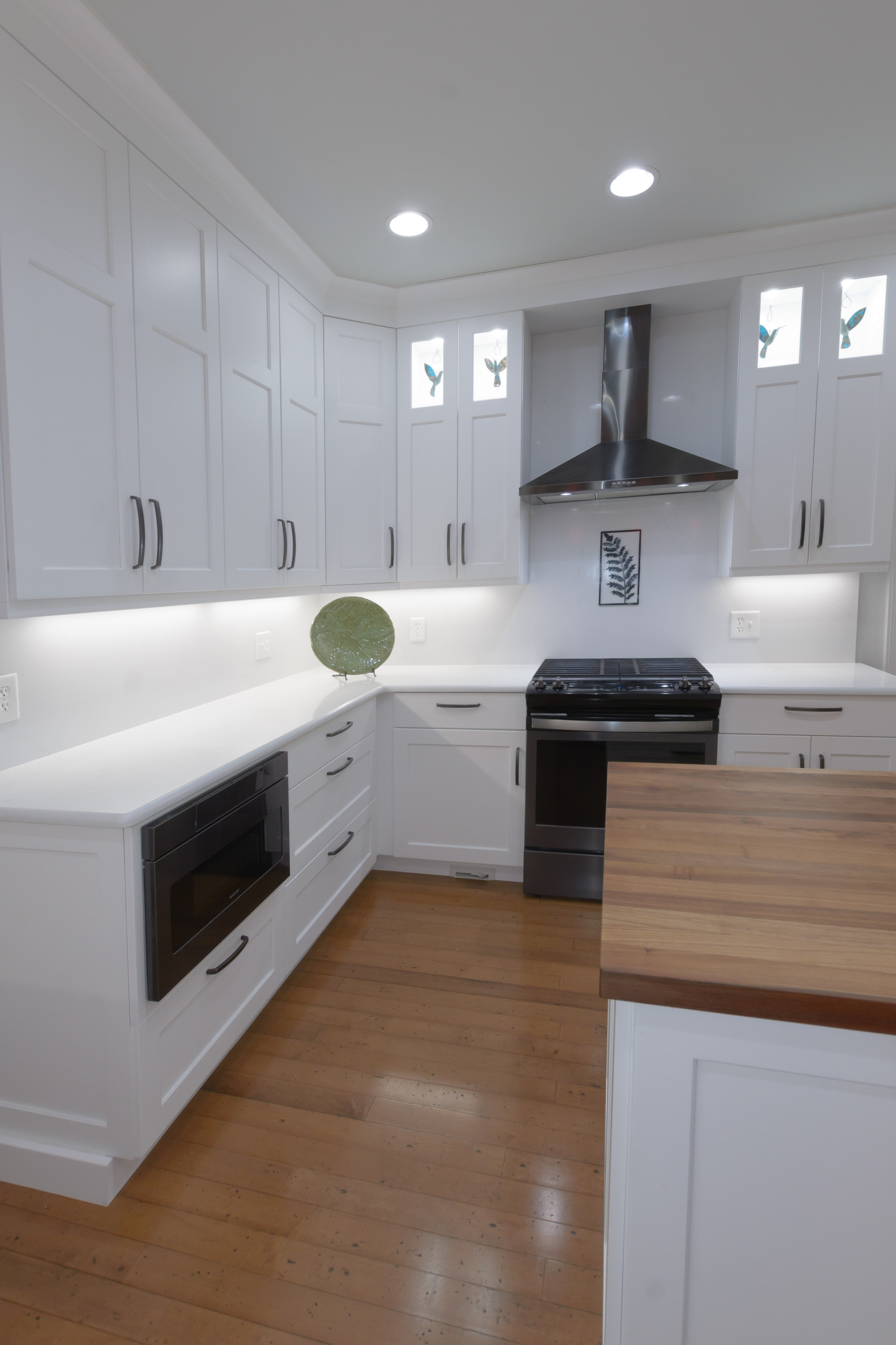 Pawley's Island modern white kitchen with butcher block island