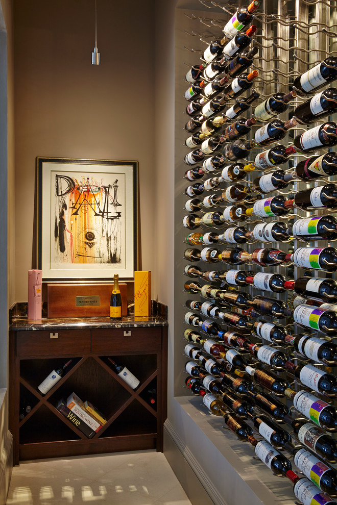 Inspiration for a small transitional wine cellar in Miami with concrete floors and storage racks.