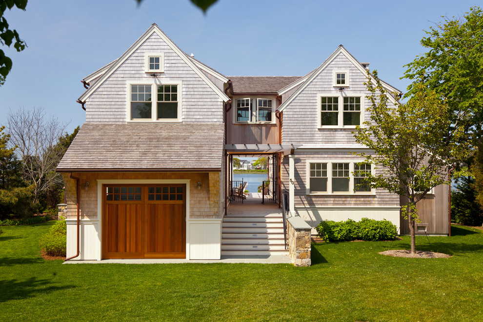 Beach style exterior in Boston with wood siding and a gable roof.