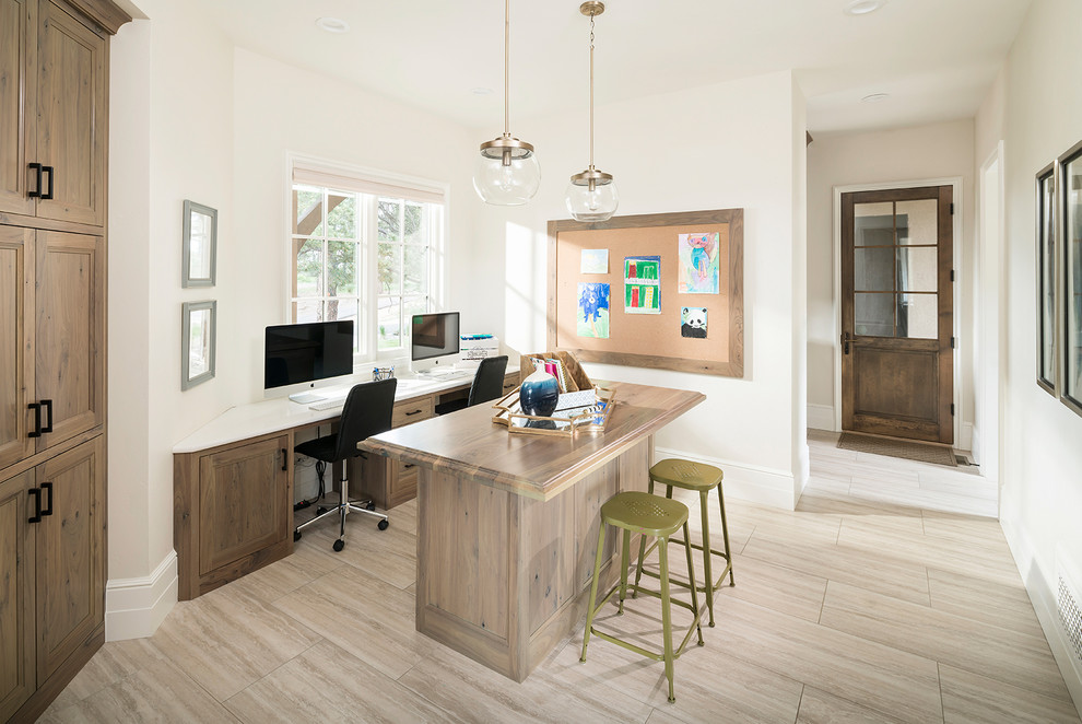 Transitional gender-neutral kids' study room in Denver with white walls and brown floor.
