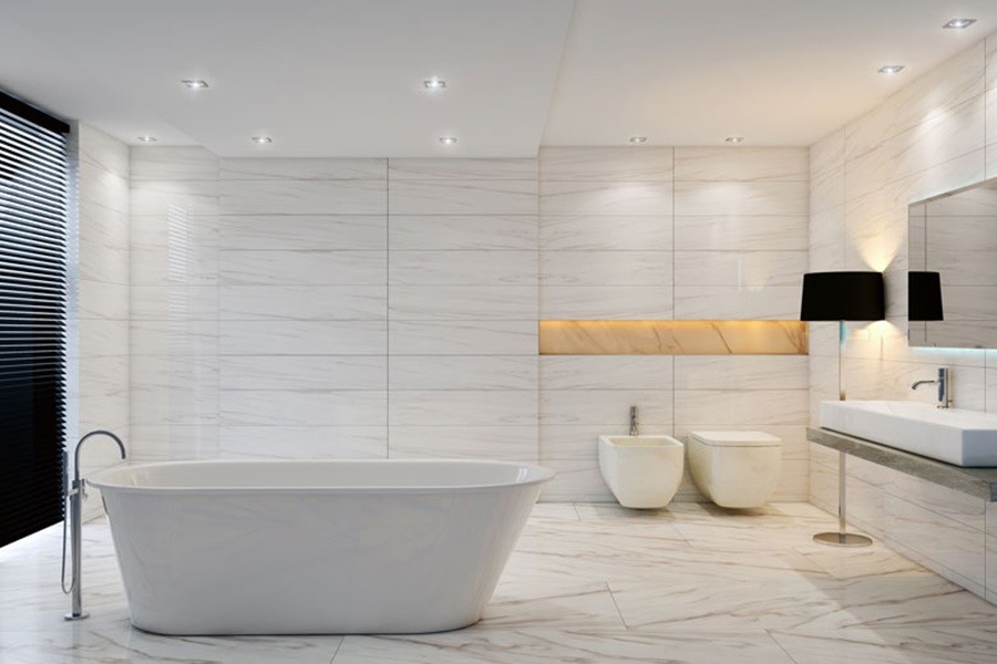 Design ideas for a large modern master bathroom in Denver with a freestanding tub, a bidet, white tile, porcelain tile, white walls, porcelain floors, a vessel sink and soapstone benchtops.