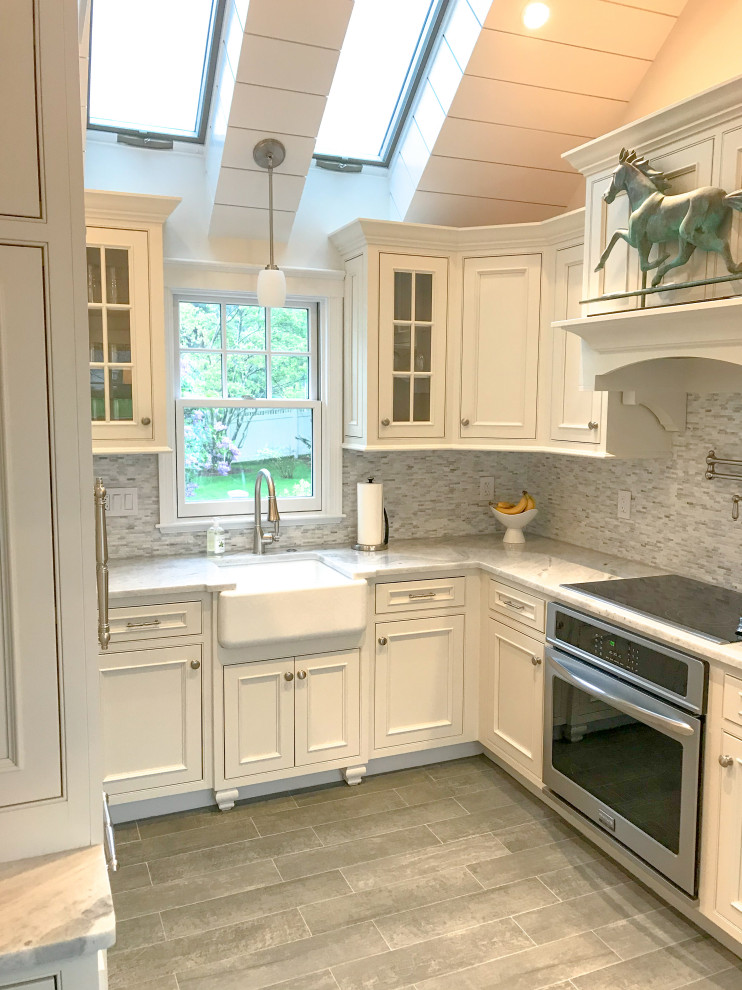 Small transitional u-shaped vaulted ceiling eat-in kitchen photo with beaded inset cabinets, white cabinets, paneled appliances and no island