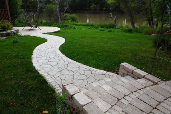 This is an example of a large transitional backyard landscaping.