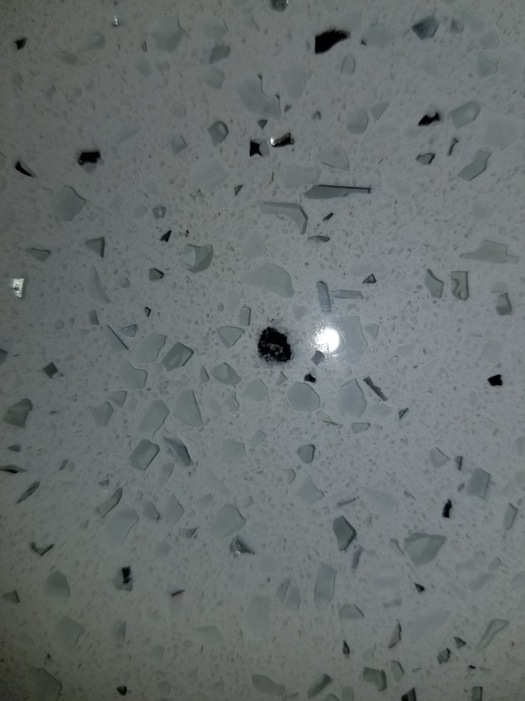 White quartz countertops, have black burn mark