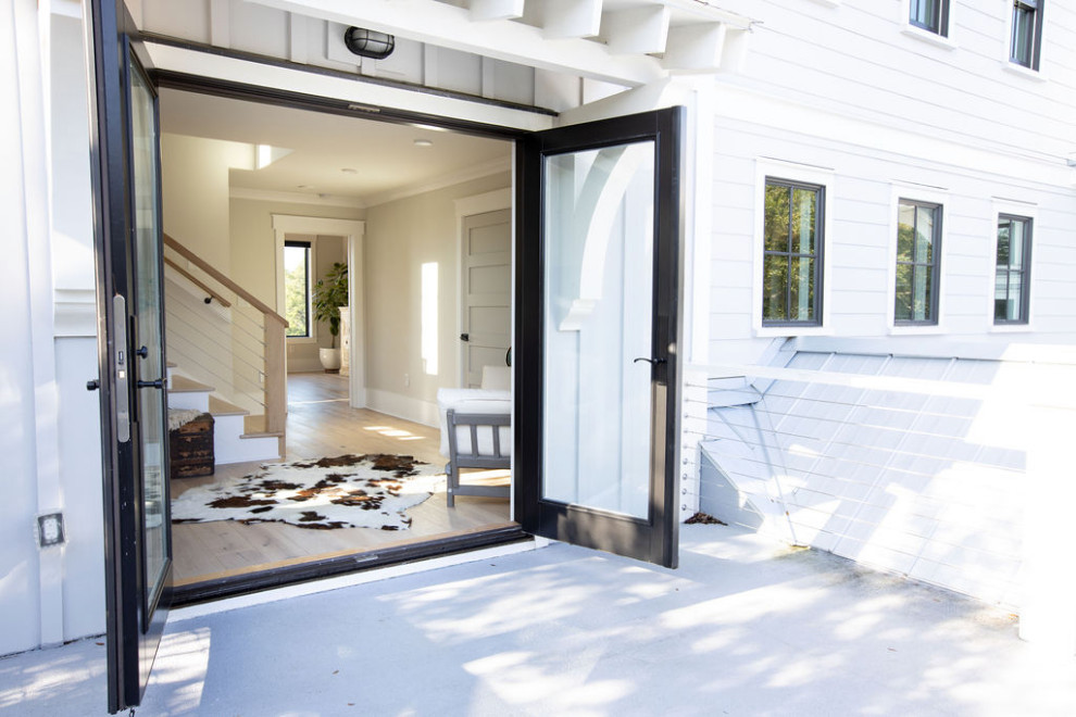 Example of a beach style home design design in Charleston