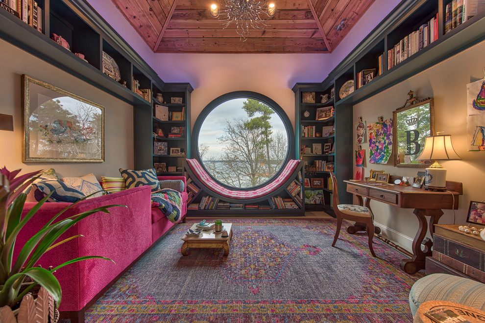 Mid-sized eclectic family room in Other with a library, blue floor and beige walls.