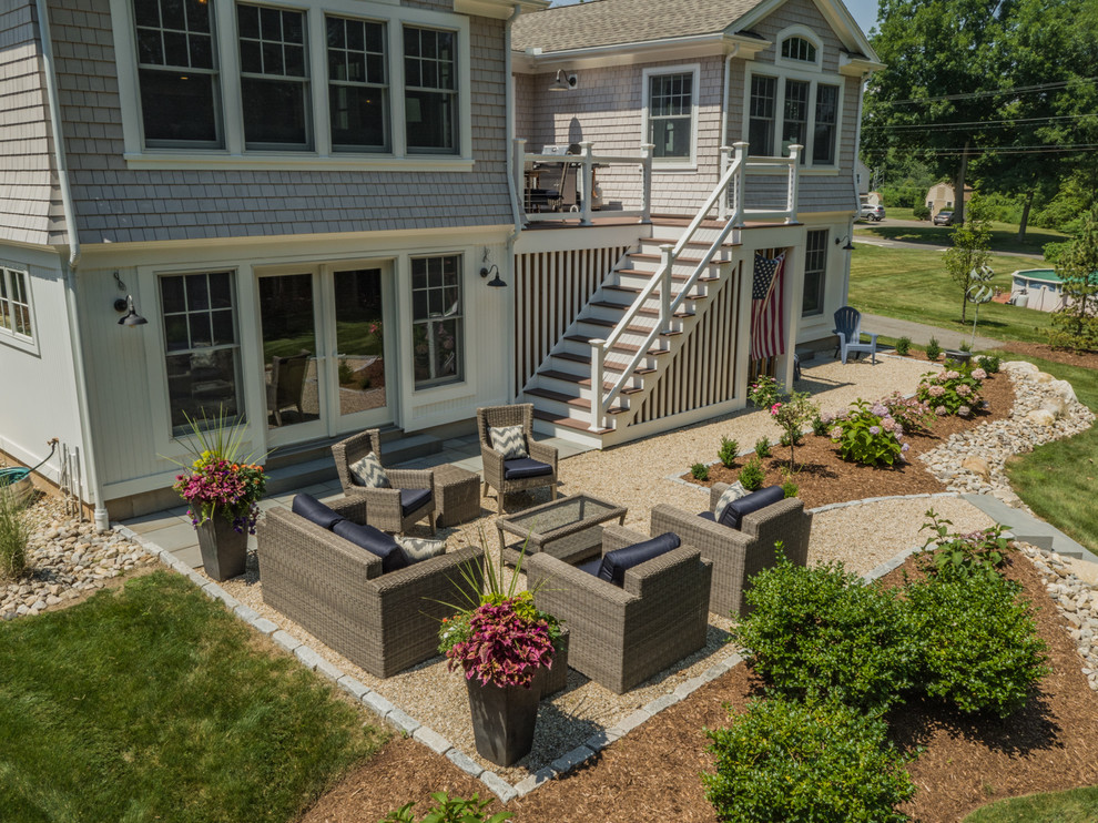 Inspiration for a mid-sized beach style backyard patio in Bridgeport with gravel and no cover.