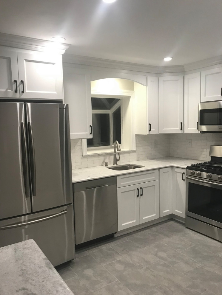 Example of a transitional kitchen design in New York