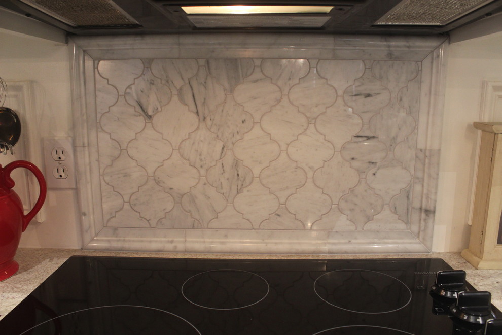 Inspiration for a mid-sized transitional u-shaped ceramic tile enclosed kitchen remodel in Phoenix with a double-bowl sink, raised-panel cabinets, white cabinets, marble countertops, gray backsplash, ceramic backsplash, stainless steel appliances and an island