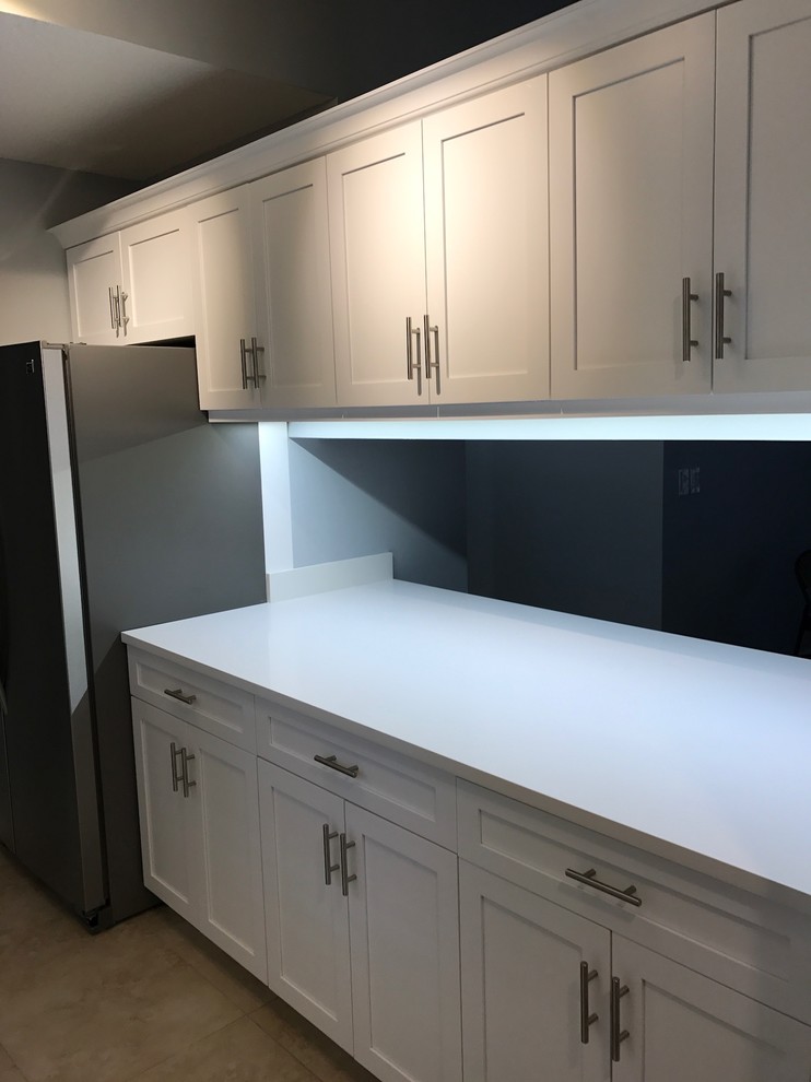 Eat-in kitchen - transitional galley eat-in kitchen idea in Miami