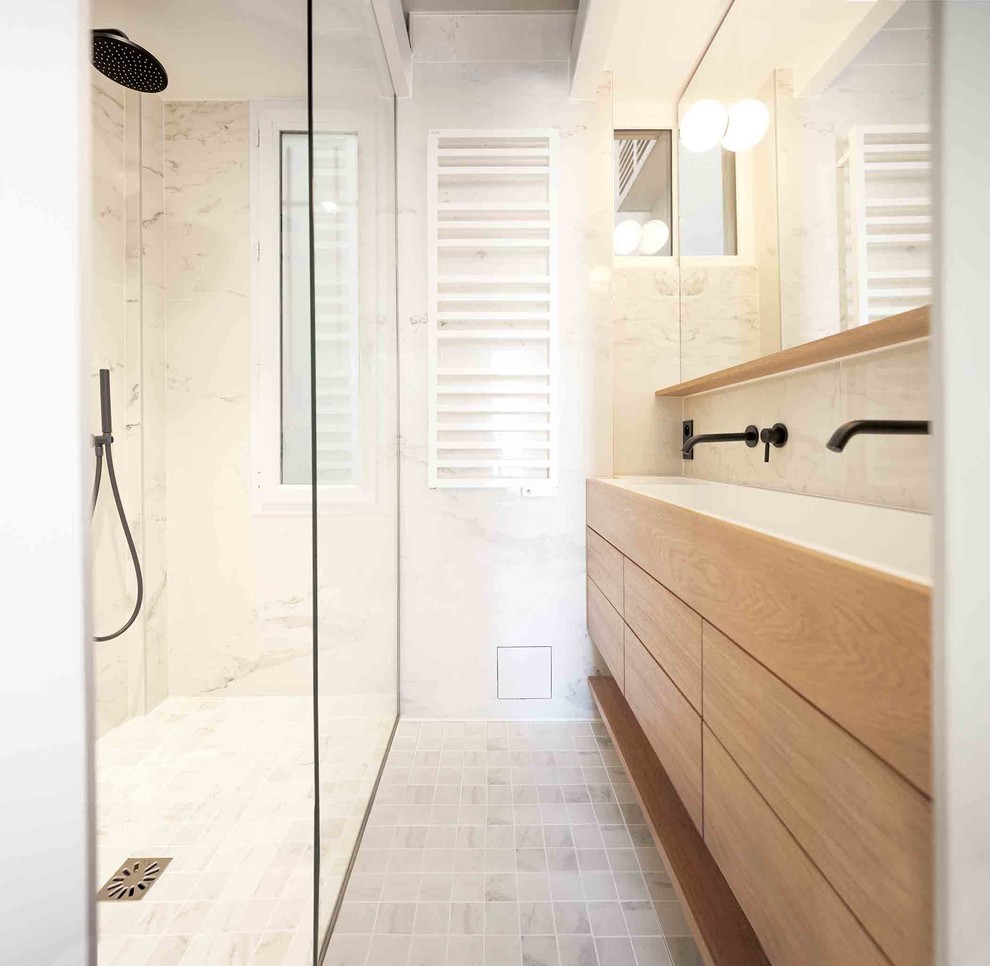 Small contemporary master bathroom in Paris with beaded inset cabinets, light wood cabinets, a curbless shower, a two-piece toilet, black and white tile, marble, beige walls, marble floors, a trough sink, solid surface benchtops, white floor, white benchtops, a double vanity and a freestanding vanity.