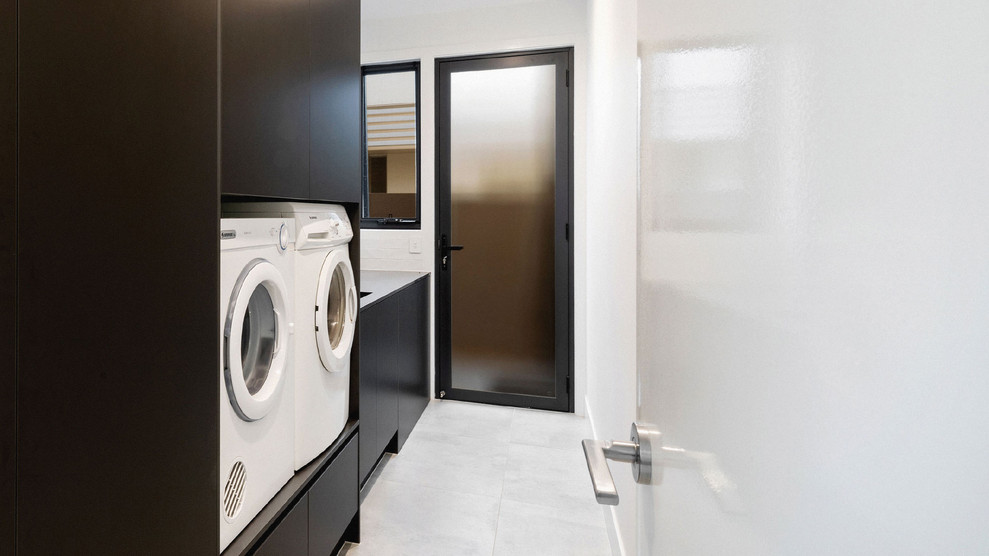 This is an example of a modern laundry room in Sunshine Coast.